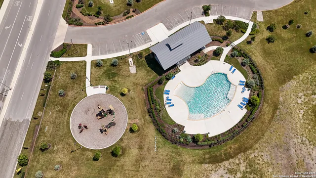 an aerial view of a house with garden