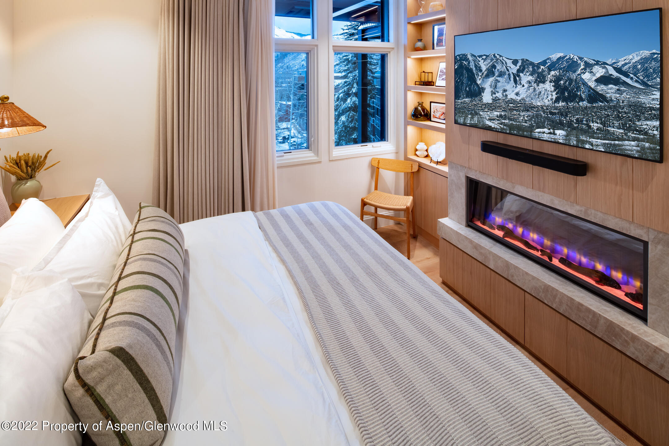 800 South Mill Street, Unit 201C Aspen, CO 81611 - Photo 7 of 13 a bedroom with bed and a painting on the wall