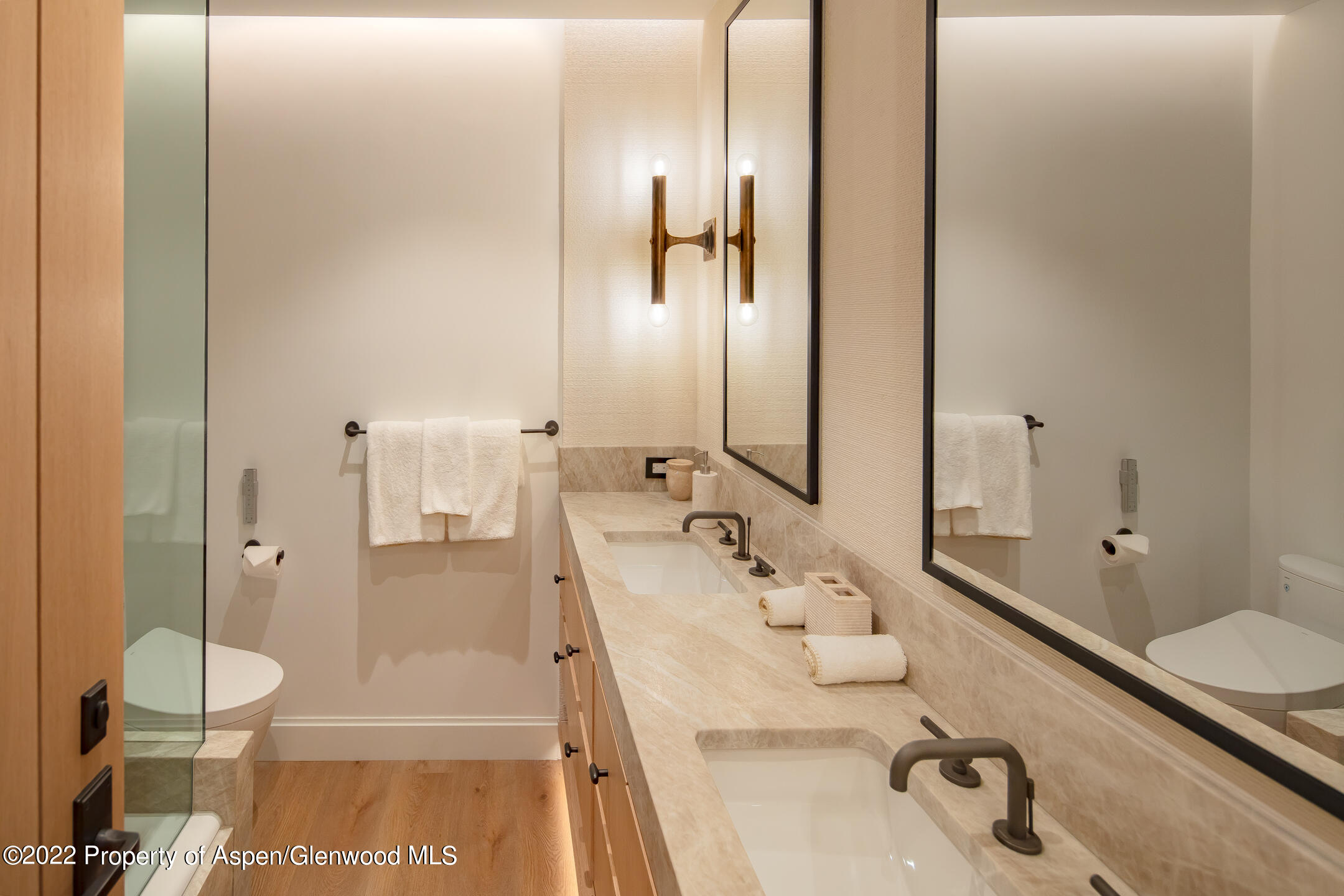 800 South Mill Street, Unit 201C Aspen, CO 81611 - Photo 9 of 13 a bathroom with a sink and a mirror