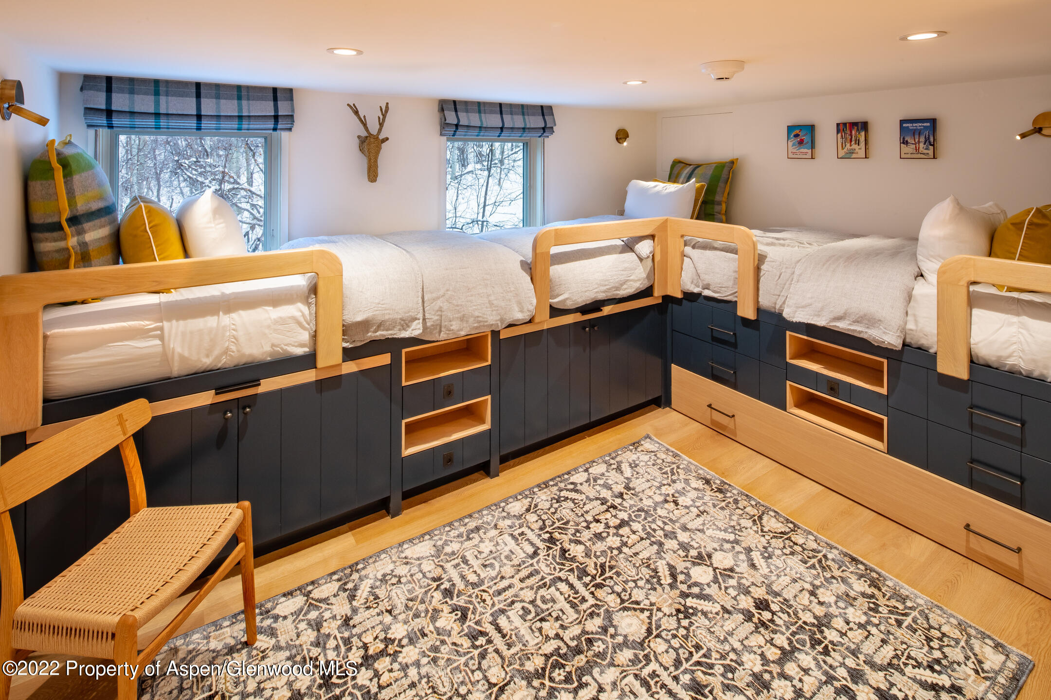 800 South Mill Street, Unit 201C Aspen, CO 81611 - Photo 10 of 13 a bed room with a bed and a couch