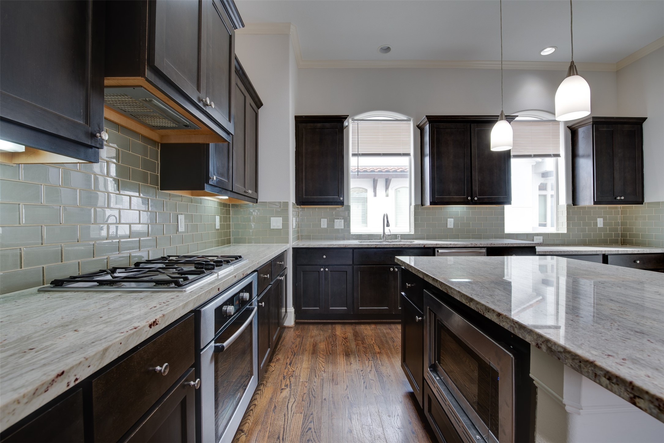 4203 Feagan Street Houston, TX 77007 - Photo 16 of 36 a kitchen with granite countertop stainless steel appliances a sink stove and cabinets