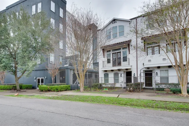 a view of a large building next to a yard