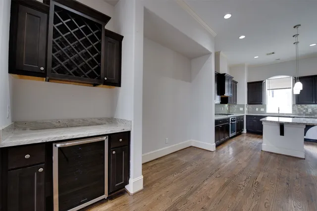 a kitchen with stainless steel appliances granite countertop a stove and a sink