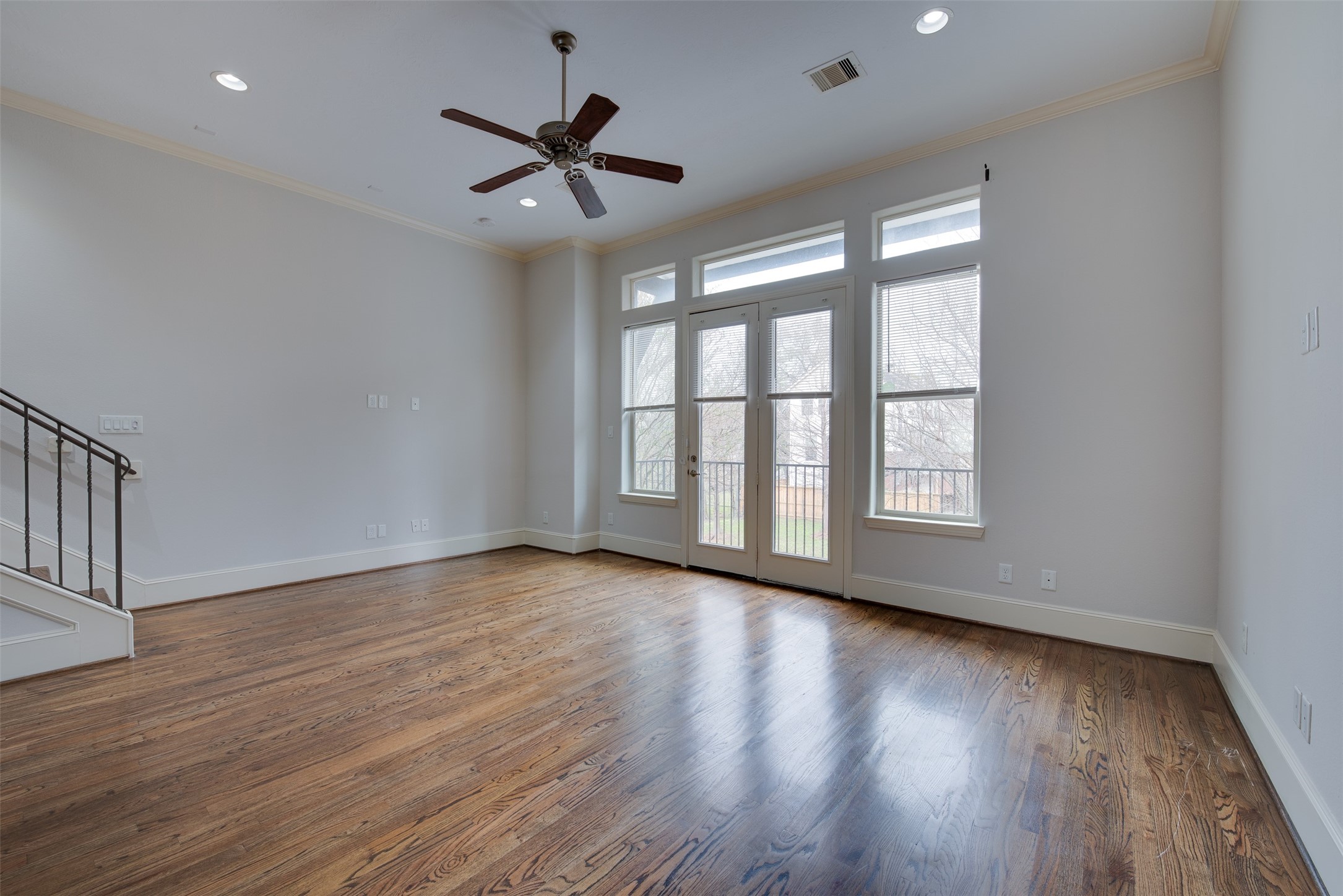 4203 Feagan Street Houston, TX 77007 - Photo 23 of 36 a view of an empty room with wooden floor and a window