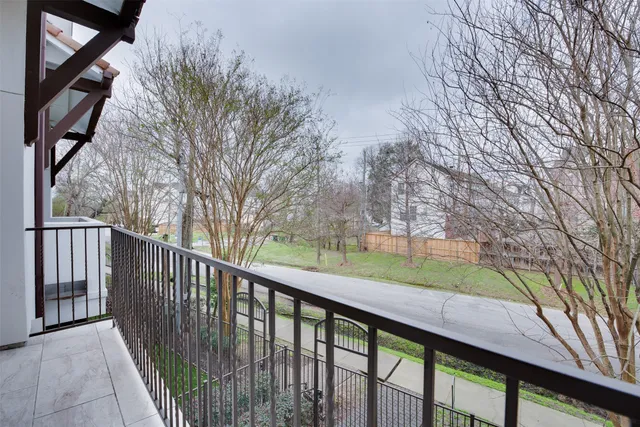 a view of a wooden deck next to a yard