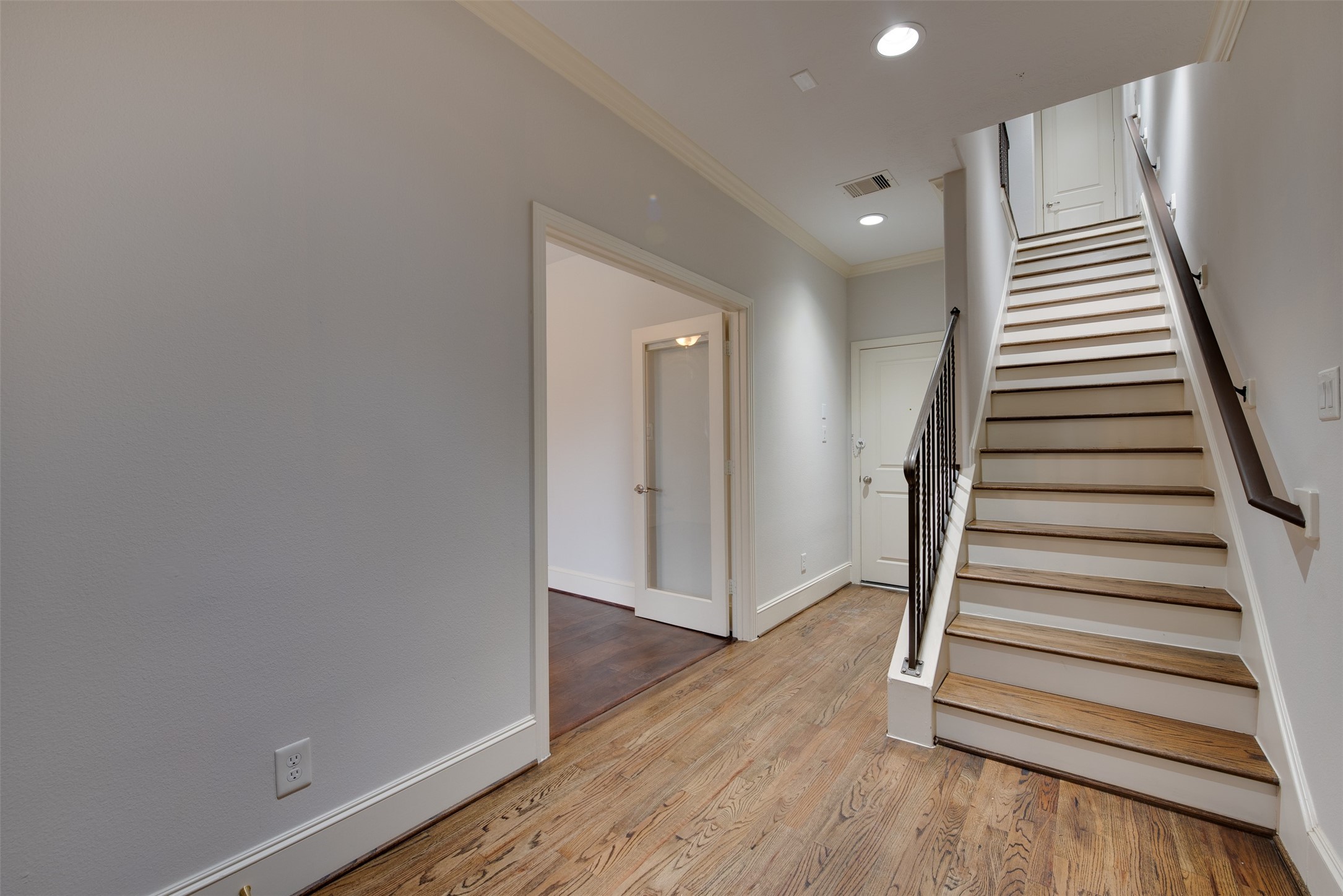 4203 Feagan Street Houston, TX 77007 - Photo 4 of 36 a view of a hallway with wooden floor and entryway
