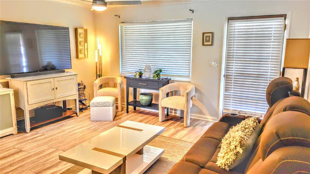 3236 South Lockwood Ridge Road Sarasota, FL 34239 - Photo 11 of 32 a bed room with a bed and a chair