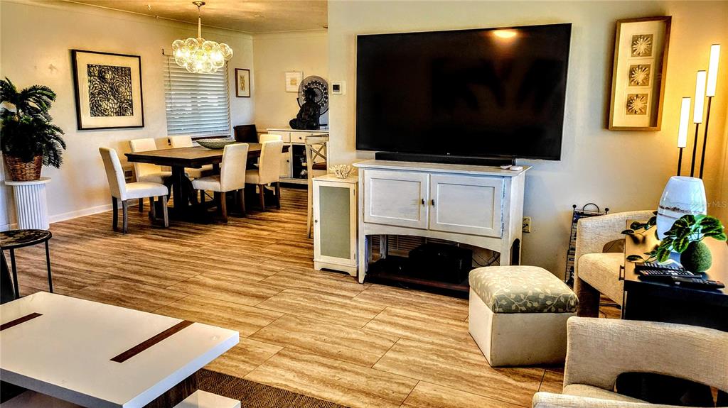 3236 South Lockwood Ridge Road Sarasota, FL 34239 - Photo 3 of 32 a living room with furniture and a flat screen tv