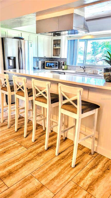 3236 South Lockwood Ridge Road Sarasota, FL 34239 - Photo 6 of 32 a view of a kitchen with a sink and cabinets