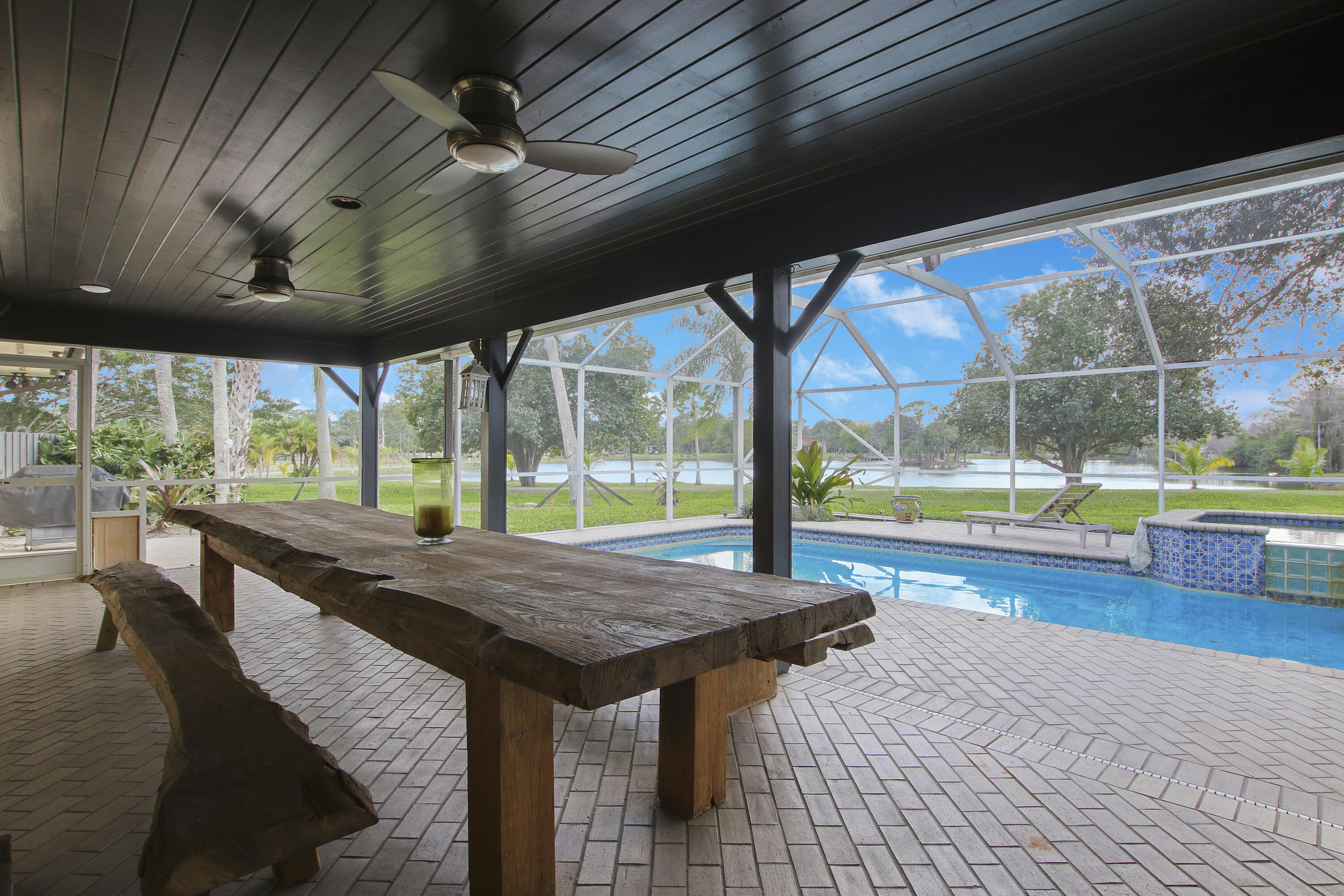 19900-addl Southeast Mack Dairy Road Jupiter, FL 33478 - Photo 43 of 50 Covered patio with pool
