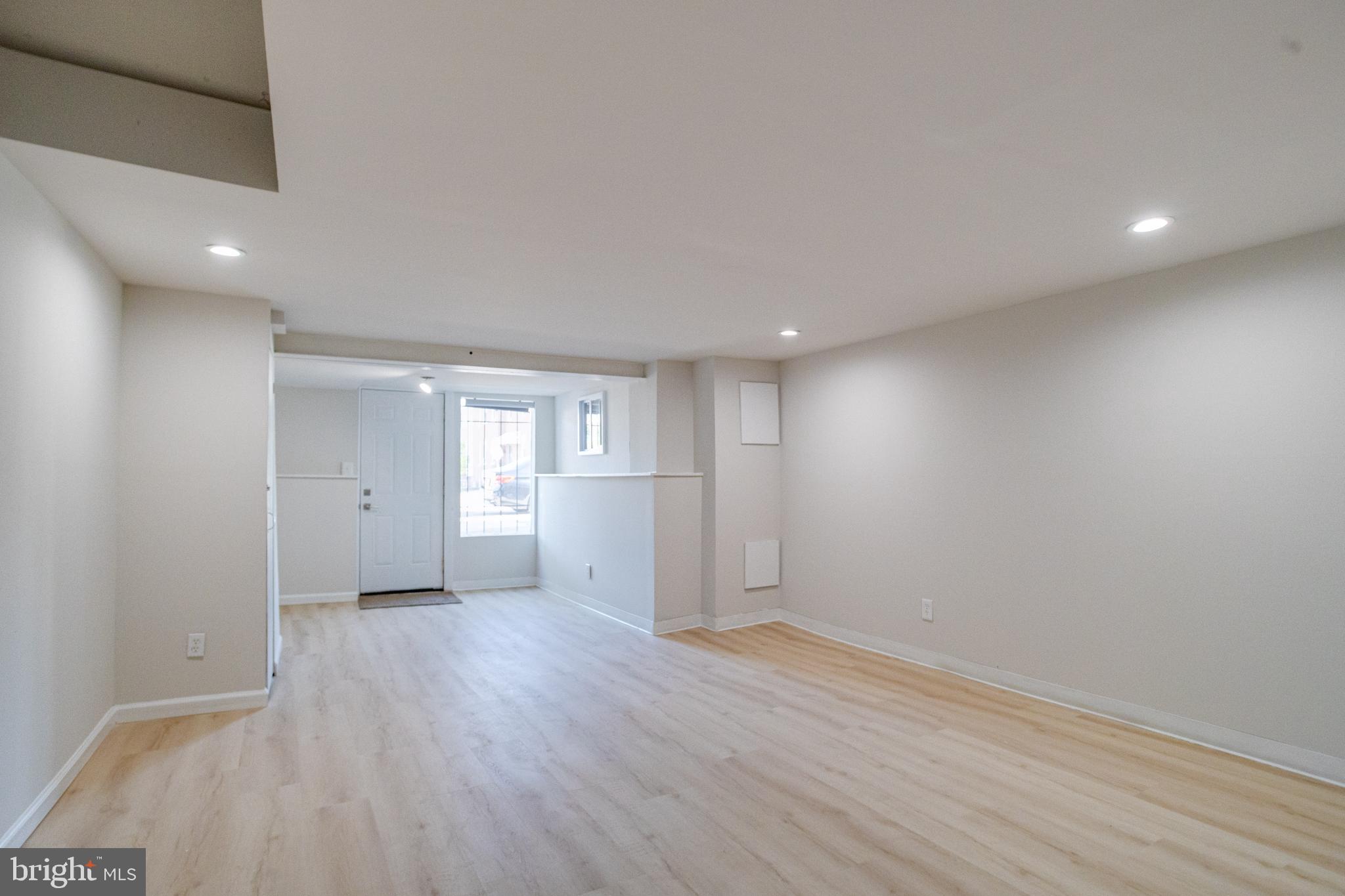 5878 Belair Road Baltimore, MD 21206 - Photo 35 of 41 a view of an empty room with wooden floor and a window