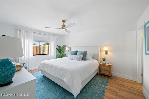a kitchen with stainless steel appliances granite countertop a sink a stove top oven a refrigerator and dishwasher