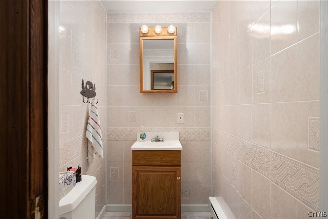 182 Oneida Road Webb, NY 13420 - Photo 15 of 29 Half bath off from the kitchen