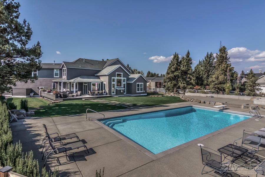63528 Old Deschutes Road Bend, OR 97701 - Photo 23 of 25 a view of a house with swimming pool