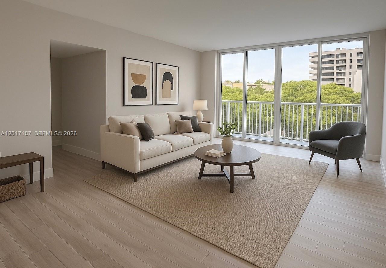 50 Ocean Ln Drive, Unit 404 Key Biscayne, FL 33149 - Photo 1 of 5 a living room with furniture and a large window