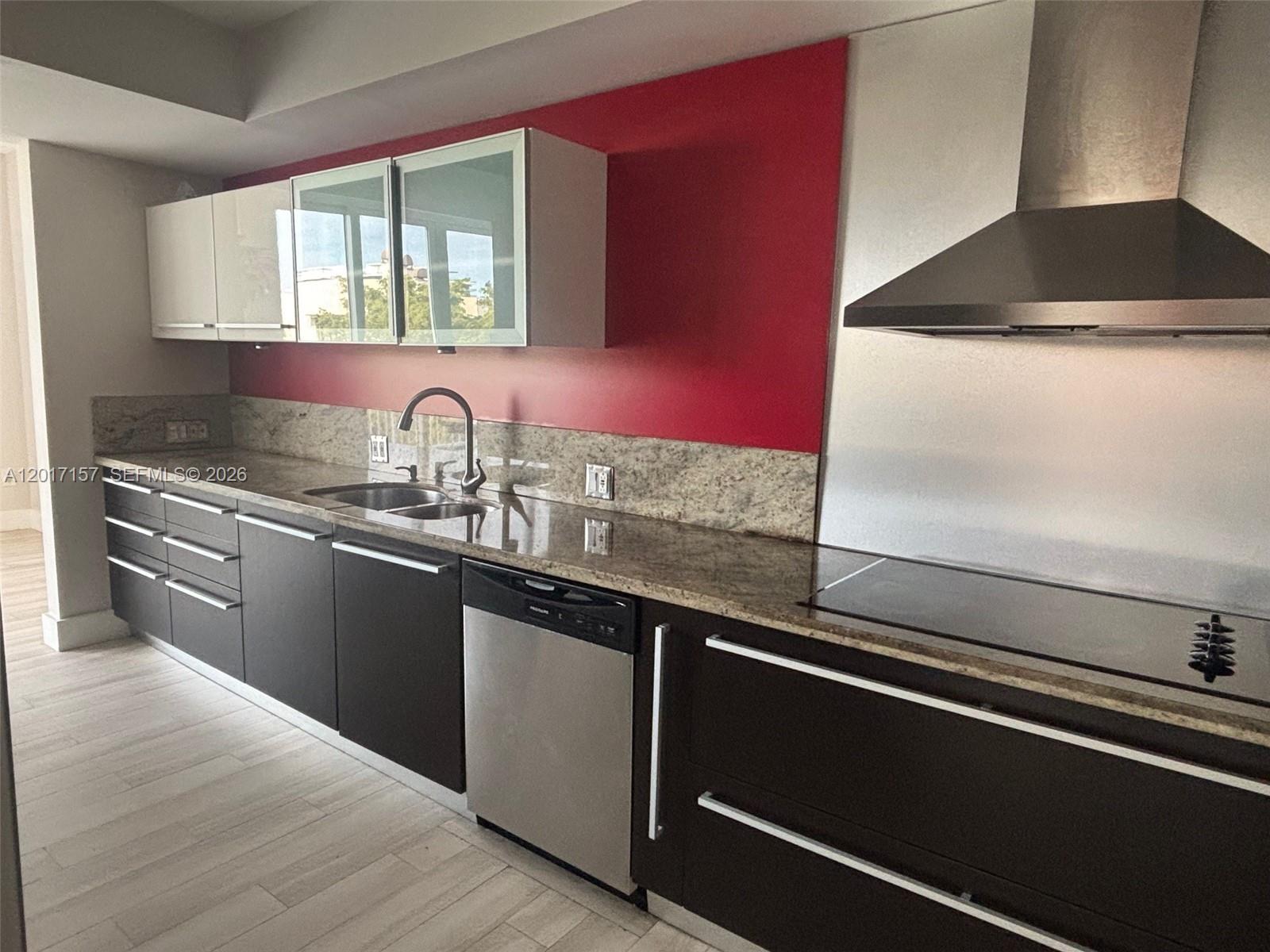 50 Ocean Ln Drive, Unit 404 Key Biscayne, FL 33149 - Photo 2 of 5 a kitchen with granite countertop a sink and a stove