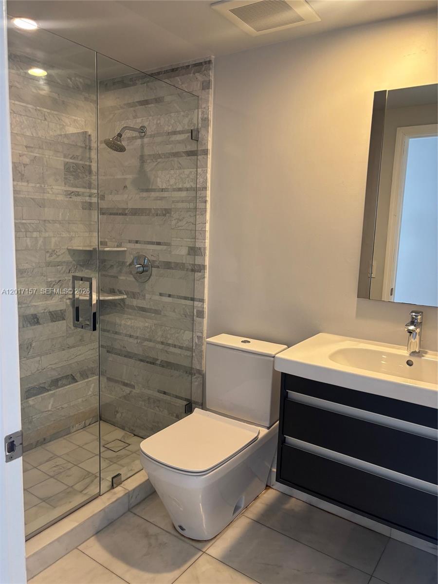 50 Ocean Ln Drive, Unit 404 Key Biscayne, FL 33149 - Photo 5 of 5 a bathroom with a toilet and a shower