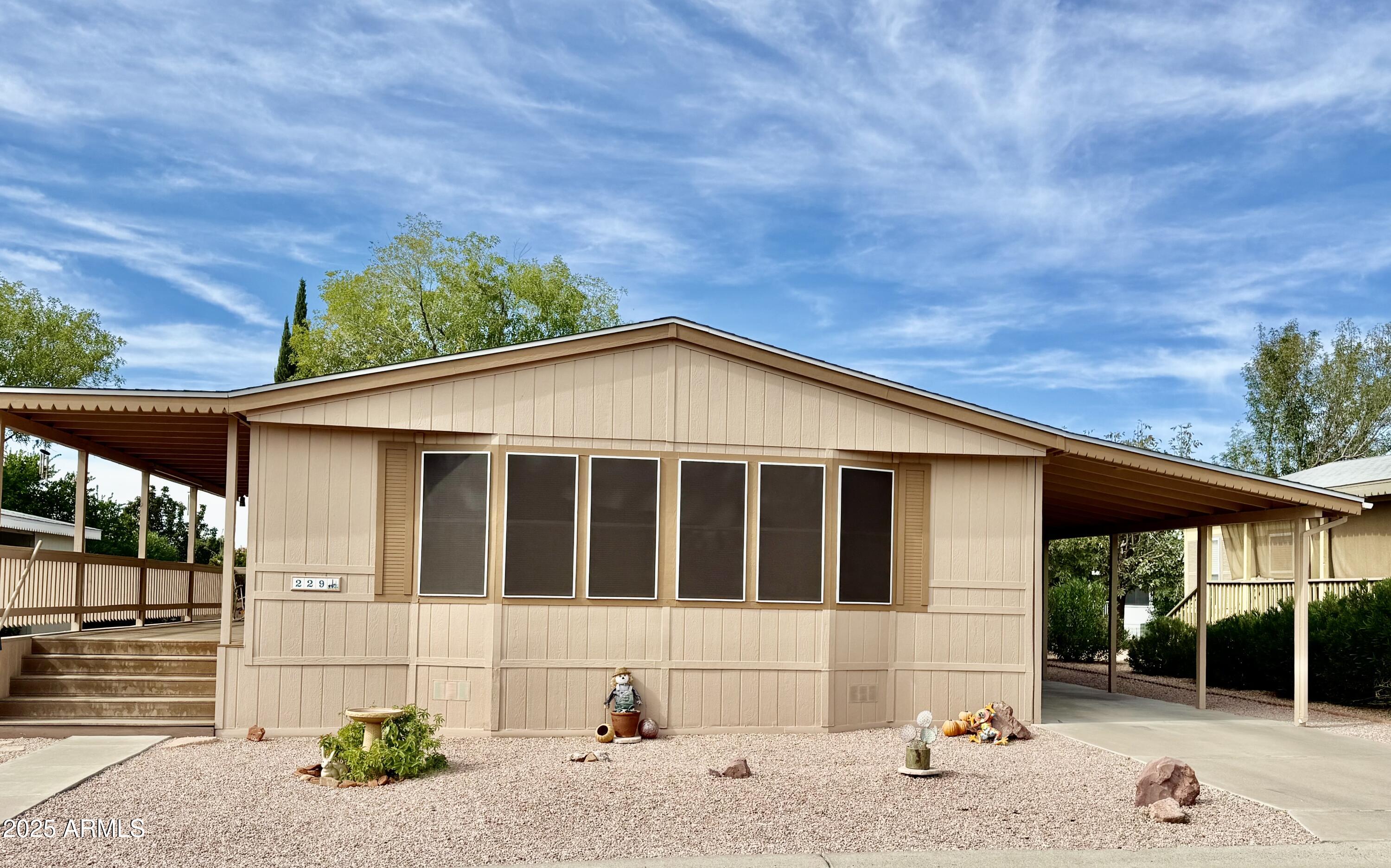a view of house with a yard