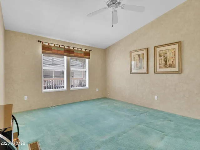 a kitchen with a sink and chairs