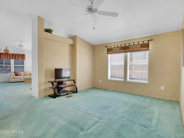 a room with a sink and a flat screen tv