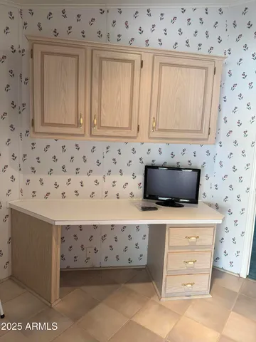 a bedroom with a bed and a lamp