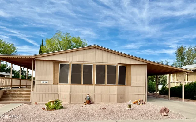 a view of house with a yard