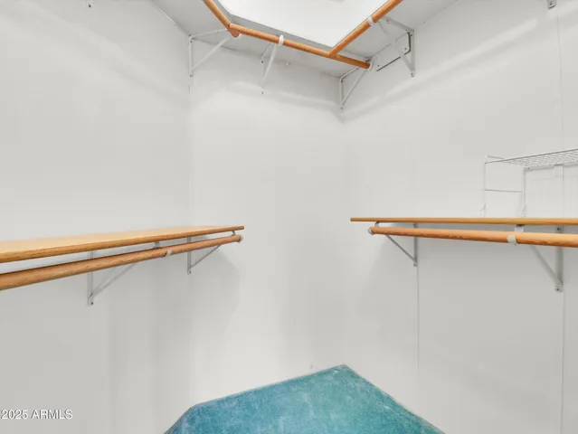 a bathroom with a granite countertop shower and a toilet