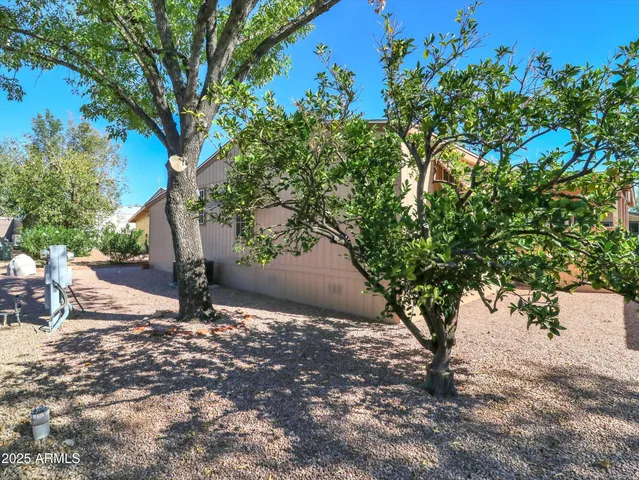 an aerial view of a houses with a swimming pool