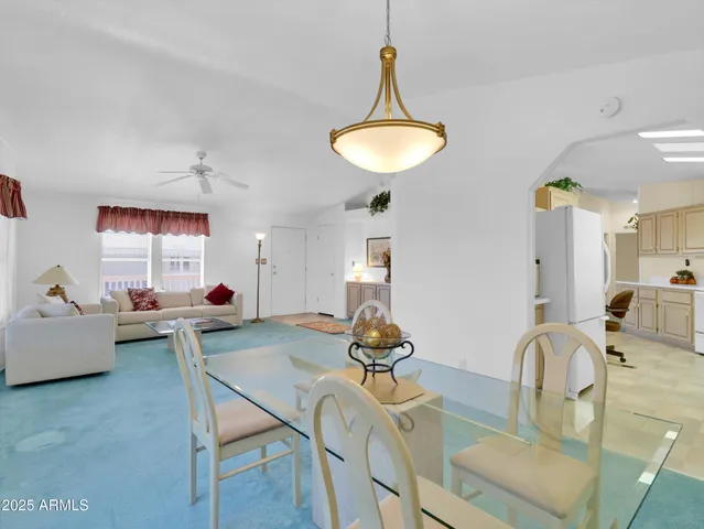a spacious bathroom with a sink mirror and a large window