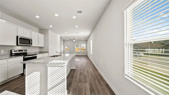 a view of a kitchen with a window