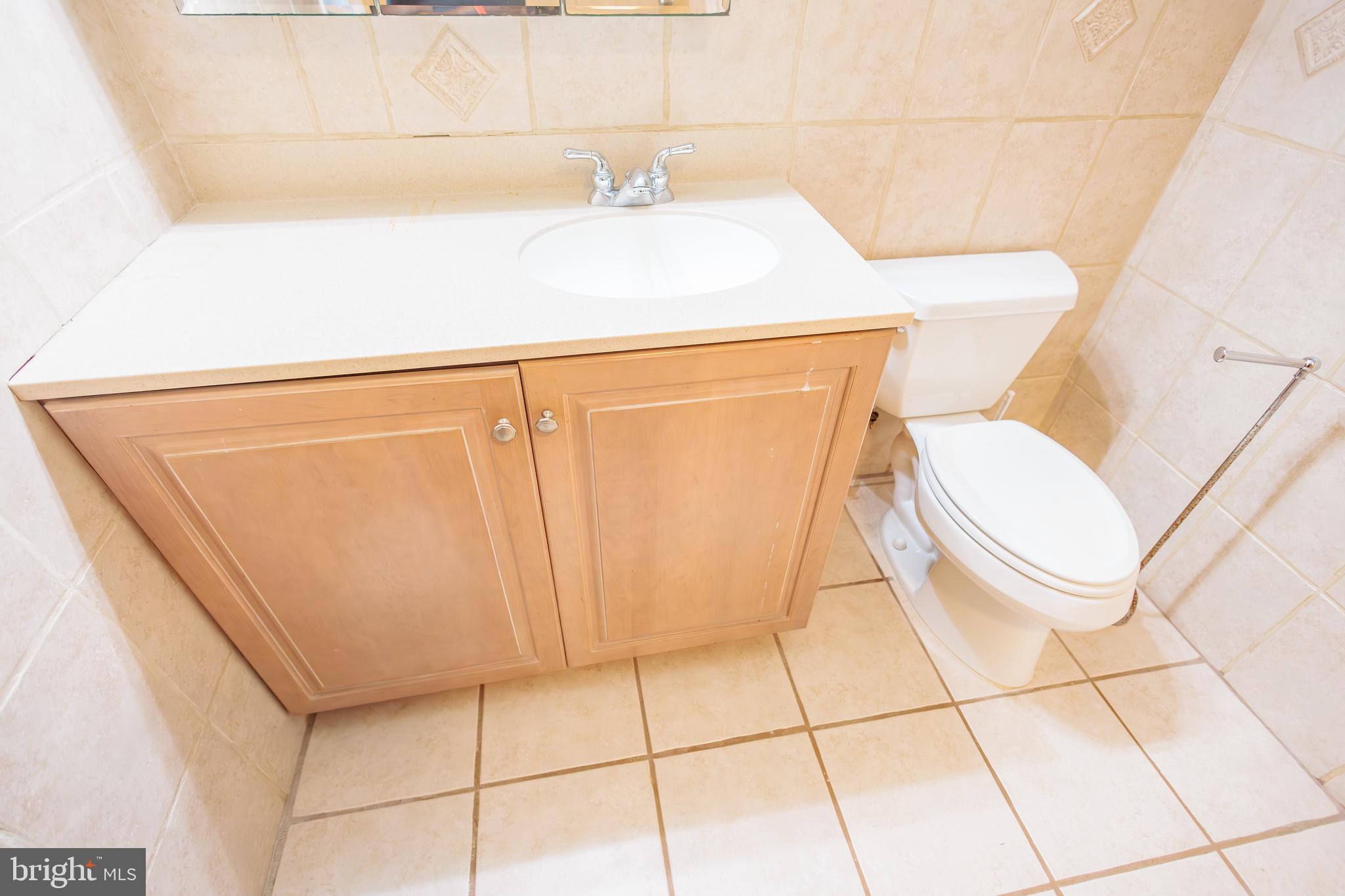 210 Deptford Road Glassboro, NJ 08028 - Photo 19 of 25 a bathroom with a sink and a mirror