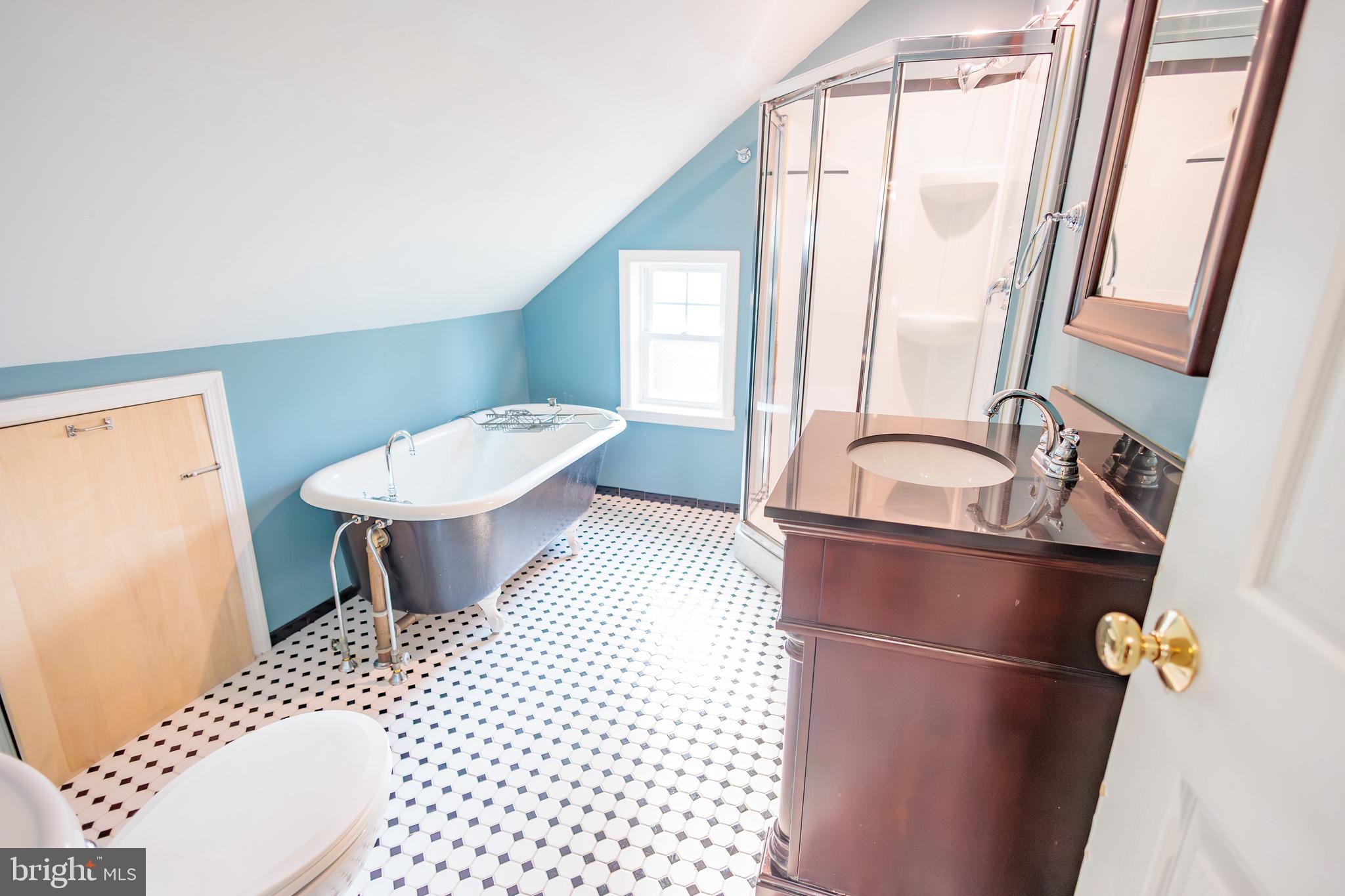 210 Deptford Road Glassboro, NJ 08028 - Photo 20 of 25 a bathroom with a sink toilet and shower