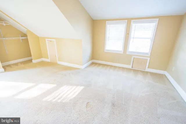 a view of a bathroom with a tub and a shower
