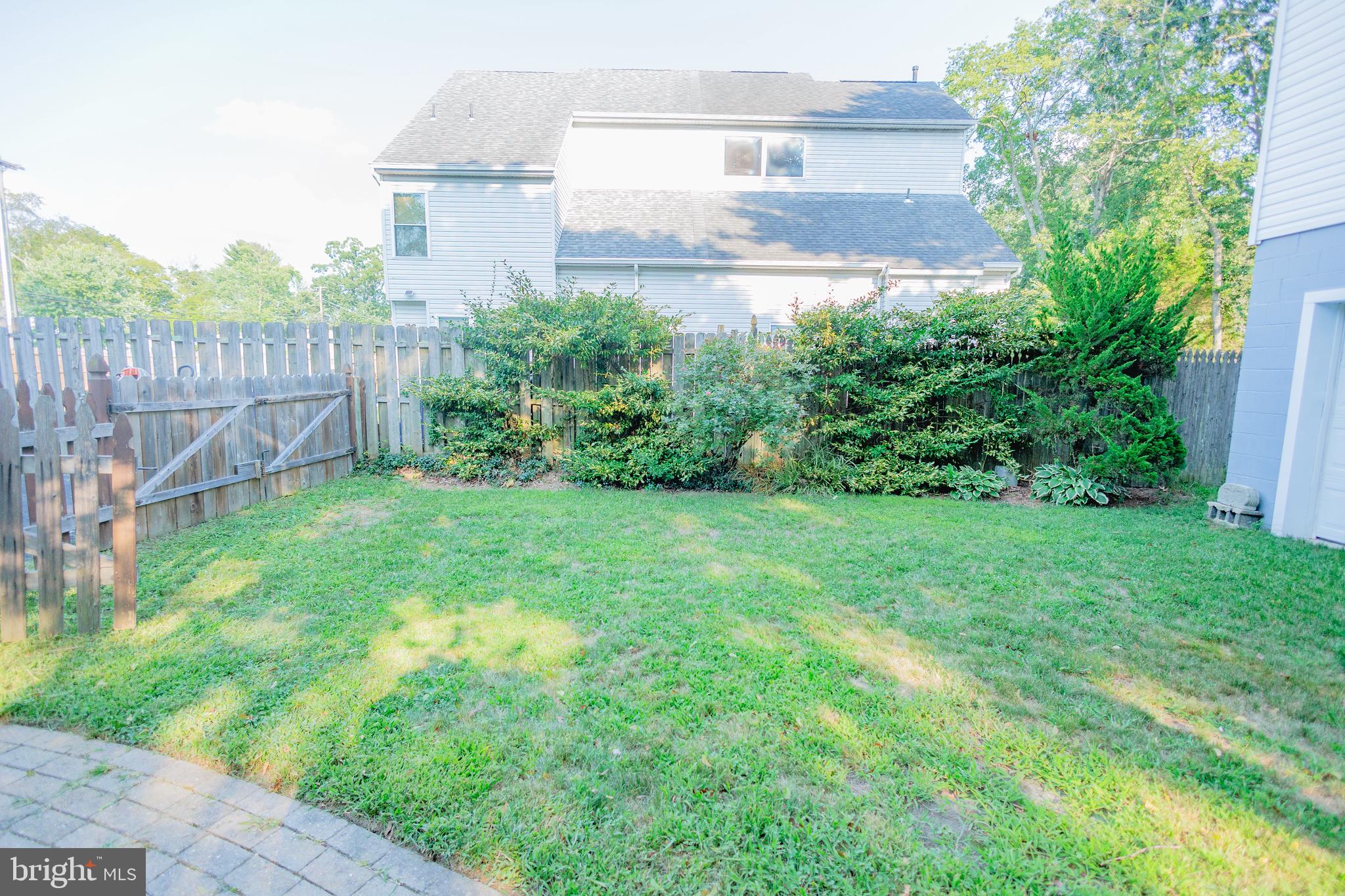 210 Deptford Road Glassboro, NJ 08028 - Photo 3 of 25 a view of a back yard