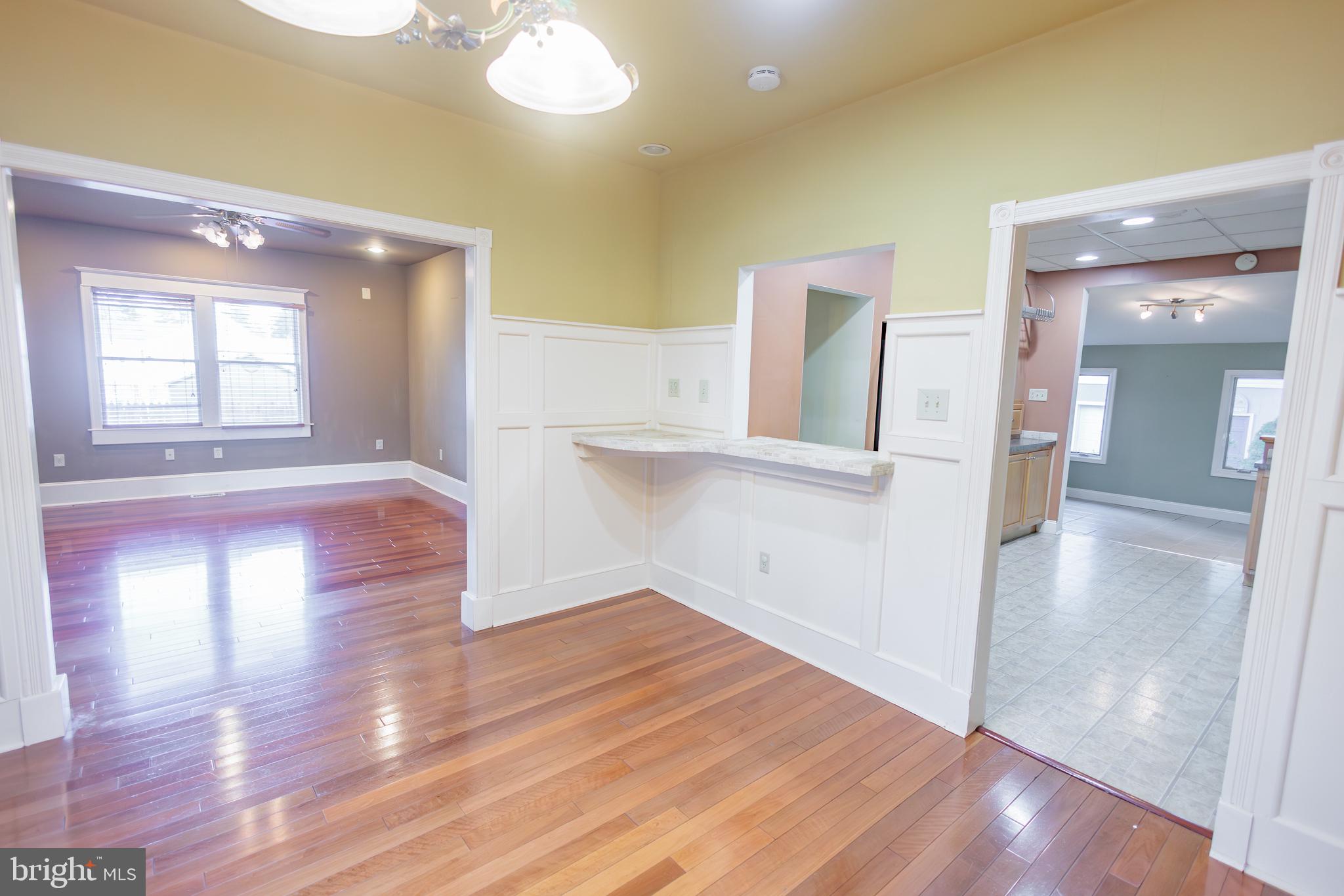 210 Deptford Road Glassboro, NJ 08028 - Photo 10 of 25 a view of a room with wooden floor and staircase
