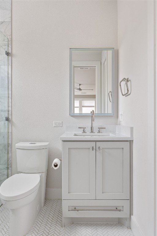 13410 Galleria Circle Austin, TX 78738 - Photo 13 of 28 a bathroom with a toilet sink vanity and mirror