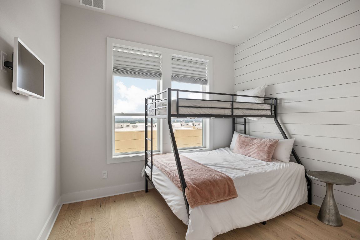 13410 Galleria Circle Austin, TX 78738 - Photo 15 of 28 a bedroom with a bed next to a window