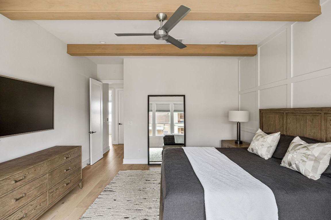 13410 Galleria Circle Austin, TX 78738 - Photo 22 of 28 a bedroom with a bed and a flat screen tv