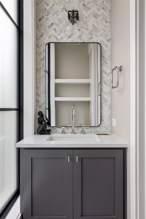 13410 Galleria Circle Austin, TX 78738 - Photo 10 of 28 a bathroom with a granite countertop sink and a mirror