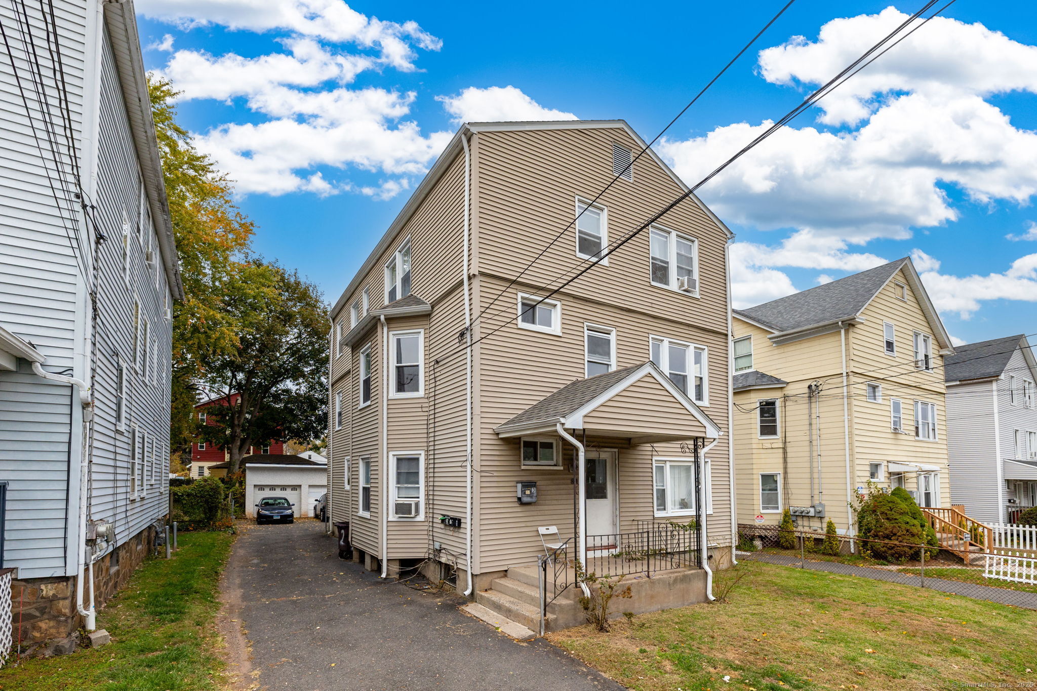 80 Belden Street, Unit 2 New Britain, CT 06051 - Photo 11 of 15 a front view of a house with garden