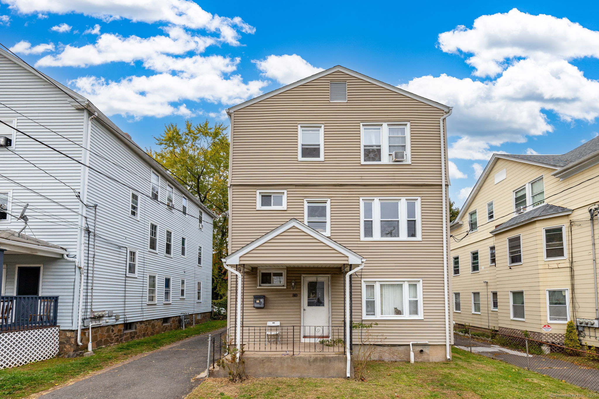 80 Belden Street, Unit 2 New Britain, CT 06051 - Photo 12 of 15 a front view of a house with garden