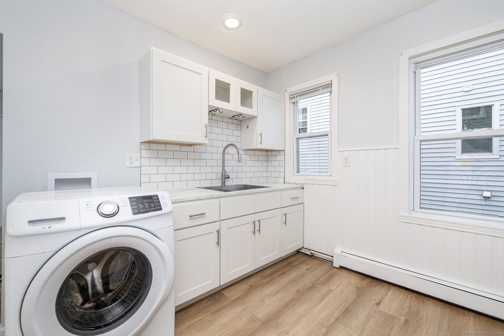 80 Belden Street, Unit 2 New Britain, CT 06051 - Photo 4 of 15 a view of a kitchen with sink washer and dryer