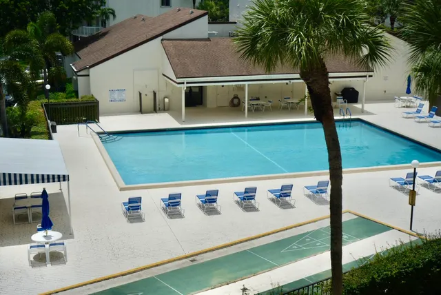 a view of swimming pool from a balcony