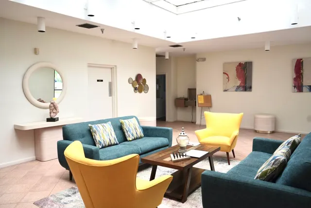 a group of people sitting at tables in a room