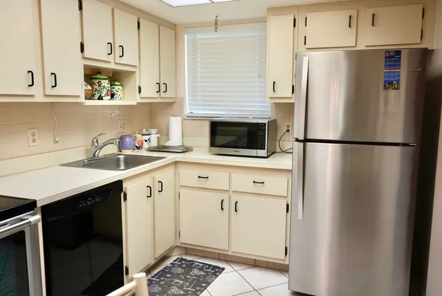 a kitchen with a stove and a microwave