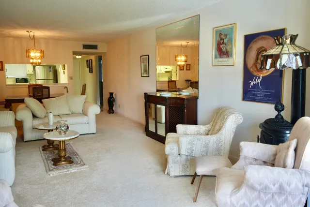 a bedroom with a bed and painting on the wall