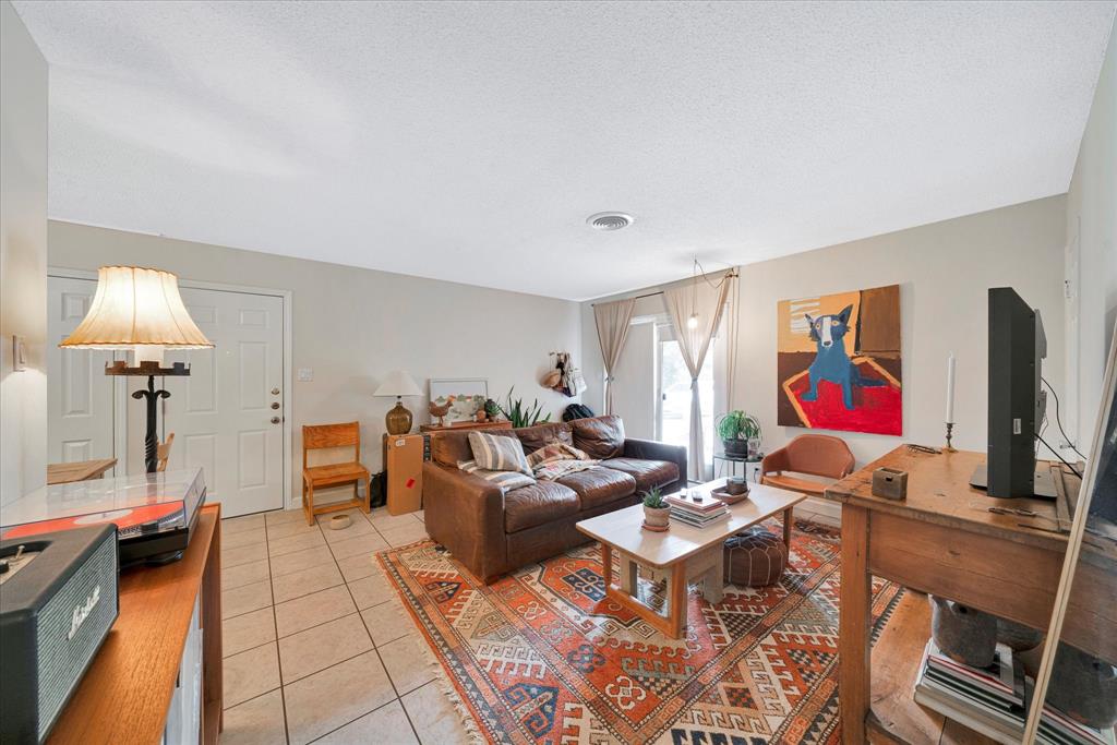 1104 Kinney Avenue, Unit B Austin, TX 78704 - Photo 5 of 14 a living room with furniture and a flat screen tv