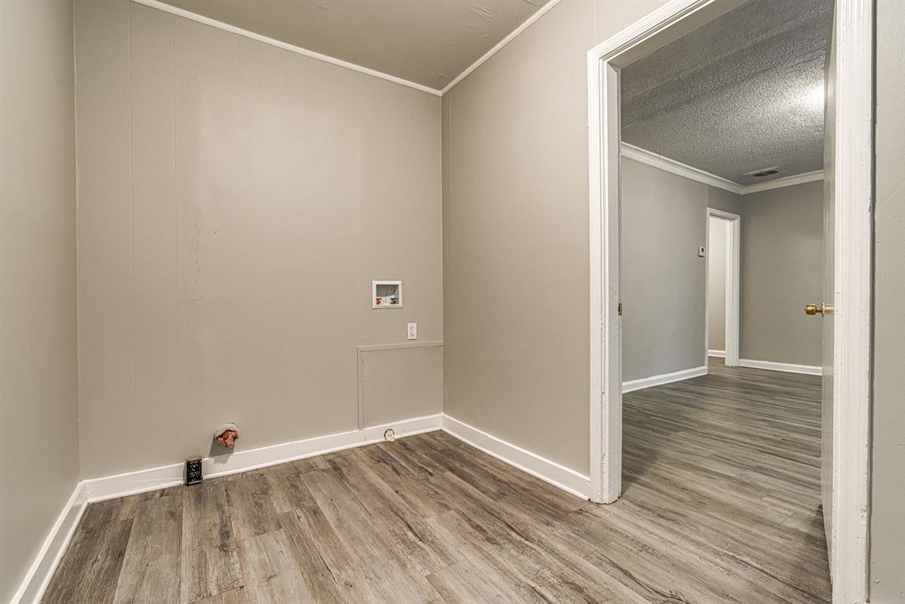1023 Parkland Road Memphis, TN 38111 - Photo 14 of 22 a view of empty room with wooden floor