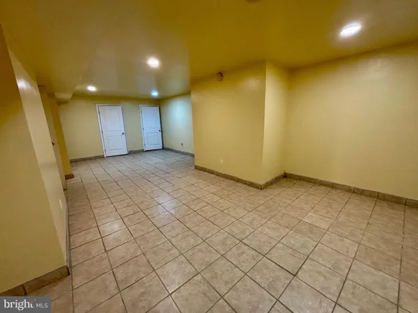a bathroom with a sink mirror vanity and toilet