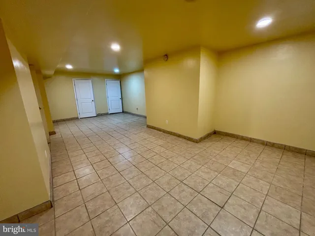 a bathroom with a sink mirror vanity and toilet